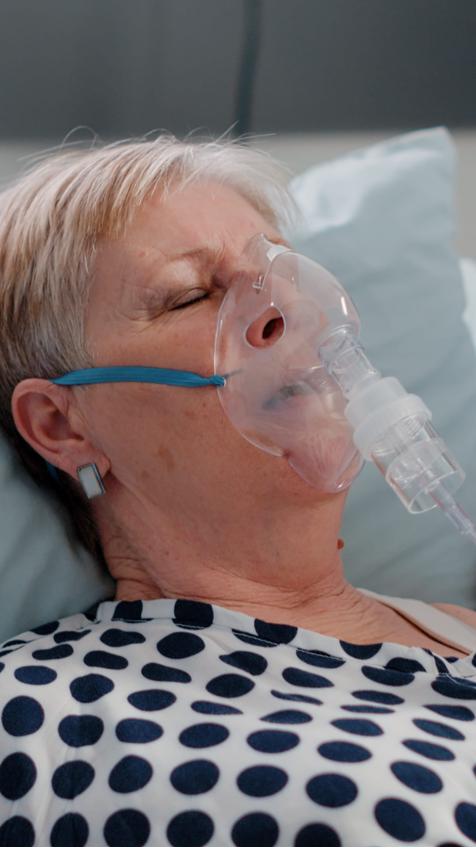 Woman with chronic bronchitis using breathing mask
