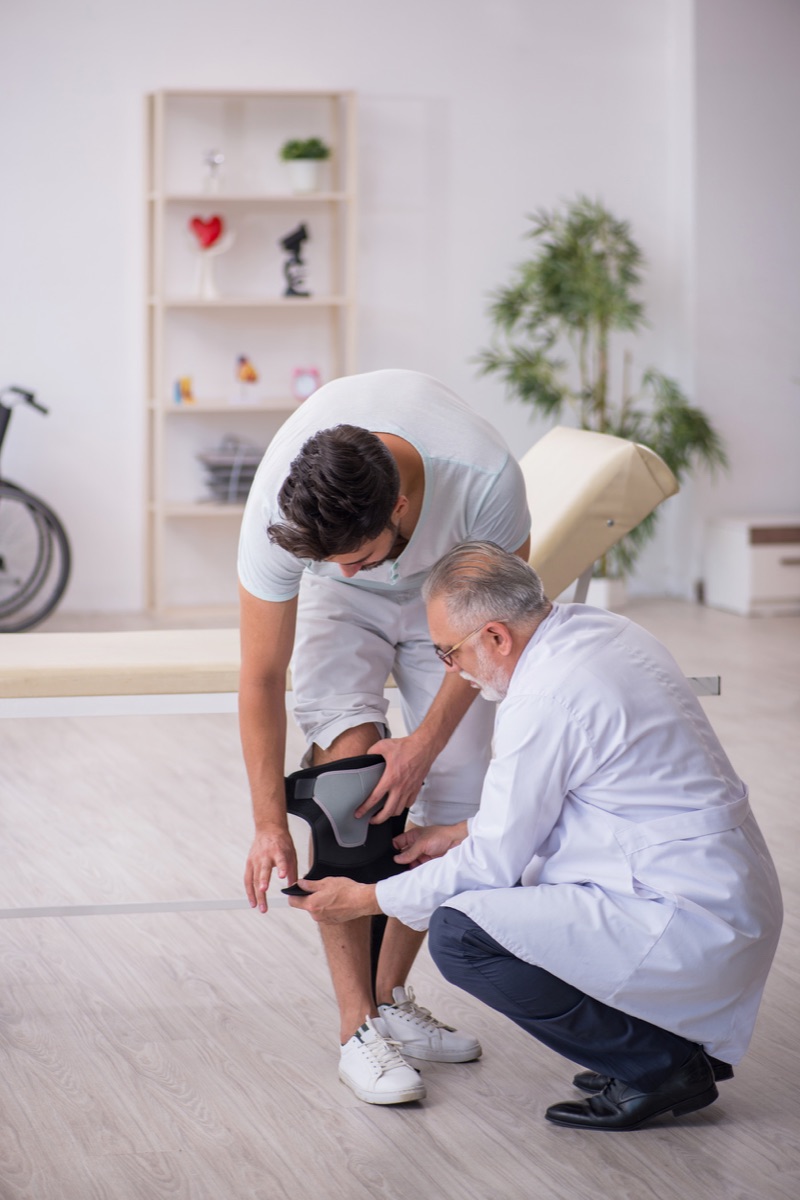 Podiatrist examining a patient's foot