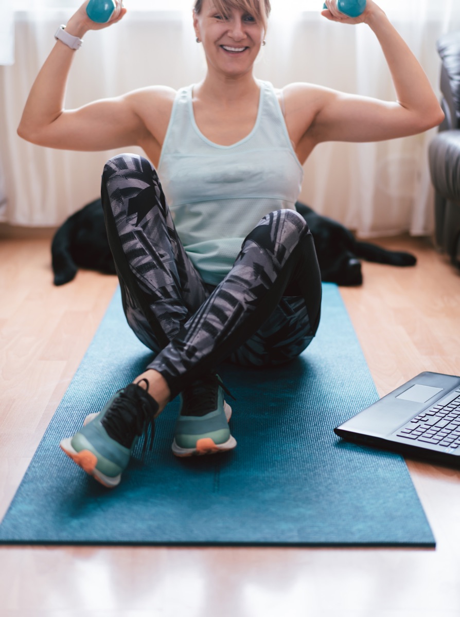Person performing back strengthening exercises on a mat